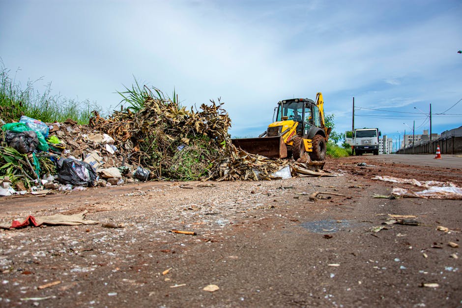 A large pile of demolition debris consisting of broken concrete, bricks, and twisted metal rebar occupying the ground level of a partially collapsed building. The rubble includes scattered fragments o